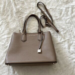 Michael Kors taupe handbag. It is 13”x10”x5.5”. Very roomy and beautiful color.